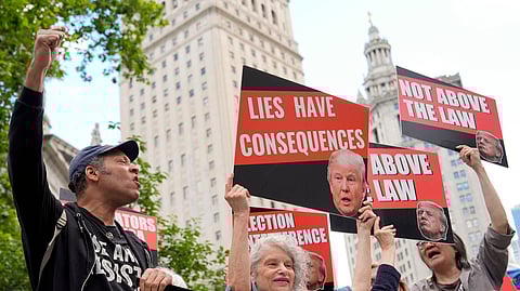 People react to the guilty verdict announced against former President Donald Trump outside Manhattan Criminal Court, Thursday, May 30, 2024, in New York.