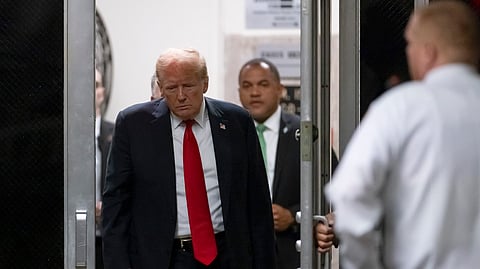Former President Donald Trump returns from a break as closing arguments continue during his criminal hush money trial in New York.