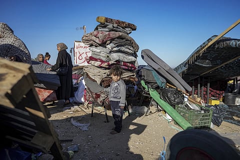 Displaced Palestinians arrive in central Gaza after fleeing from the southern Gaza city of Rafah in Deir al Balah, Gaza Strip on Wednesday, May 8, 2024.