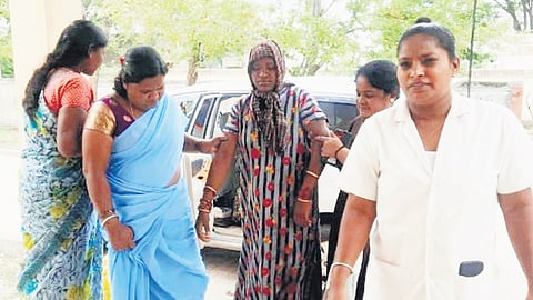 A woman who delivered a baby in a car being brought to Hanur Primary Health Centre