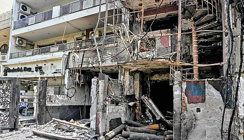 The charred building of the Baby Care Hospital after a fire broke out on Sunday. Seven newborns were killed and five others were injured.