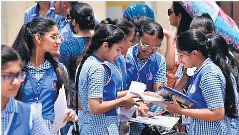 Students seen discussing about the answers after the exam
