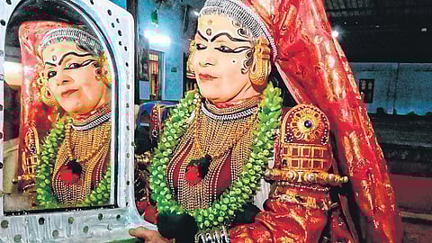 Kathakali artist C S Devayani takes a look at her attire before performing as Lalitha in ‘Poothanamoksham’ in Mavelikkara on Sunday