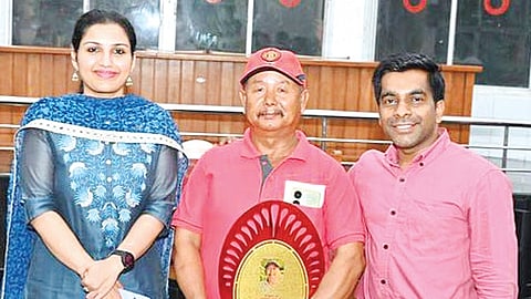 Wayanad Collector Renu Raj and DTPC secretary K G Ajesh along with Sona Lama on his retirement day at the collectorate