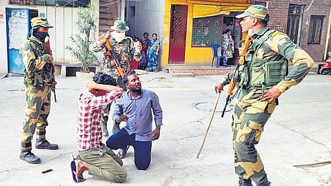 CRPF personnel took people, who reportedly attempted to cast bogus votes, into custody at Doddapuram in Tirupati