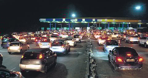 A long line of vehicles is seen at Panthangi toll plaza, Choutuppal, Nalgonda district on Monday evening.