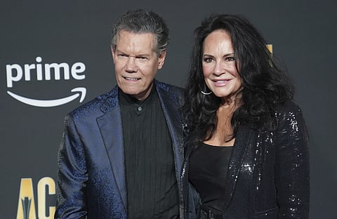 Randy Travis, left, and Mary Davis appear at the 58th Annual Academy of Country Music Awards on Thursday, May 11, 2023, in Frisco, Texas.