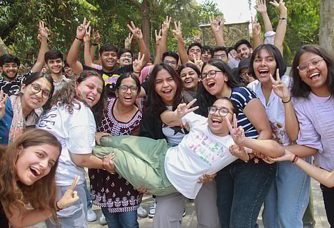 Students celebrate after the announcement of class 12th board exam results by the Central Board of Secondary Education (CBSE), in Gurugram, Monday, May 13, 2024.