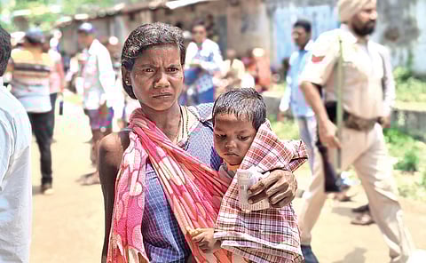 A woman of Kotia panchayat in Pottangi block reaches the booth to exercise her franchise