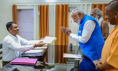 Prime Minister Narendra Modi, accompanied by UP CM Yogi Adityanath and Ganeshwar Shastri, files his nomination papers for Lok Sabha polls, in Varanasi, Uttar Pradesh, Tuesday, May 14, 2024.