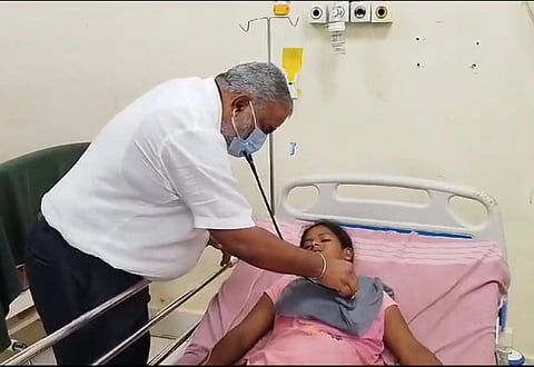 Doctor checks on Yashodha, sister of deceased Anjali Ambiger at the KIMS hospital in Hubballi