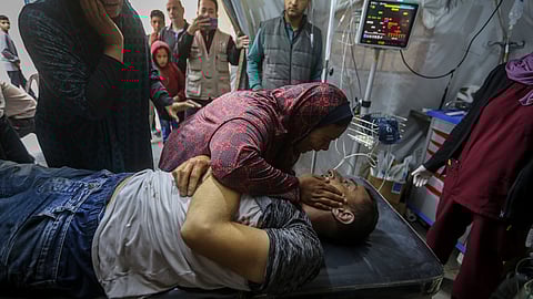 Palestinians mourn their relatives killed in the Israeli bombardment of the Gaza Strip, at a hospital in Rafah, Gaza.