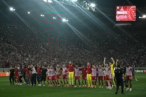 Olympiakos' players celebrate reaching the final of UEFA Europa Conference League in front of their fans after their victory in their semi final second leg football match against Aston Villa at the Georgios Karaiskakis Stadium, in Piraeus, on May 9, 2024.