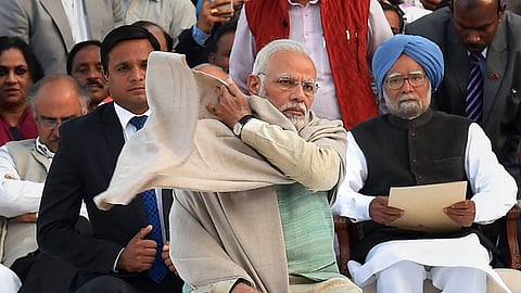 Former Prime Minister Manmohan Singh with PM Narendra Modi.