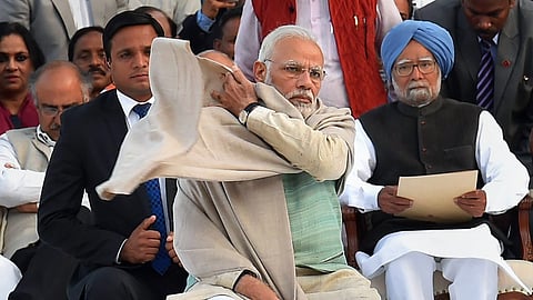 Former Prime Minister Manmohan Singh with PM Narendra Modi.