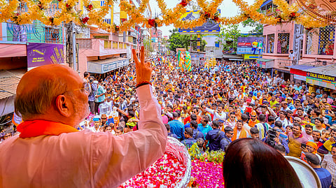Union Home Minister and BJP leader Amit Shah during a road show for Lok Sabha elections, in Krishnanagar.