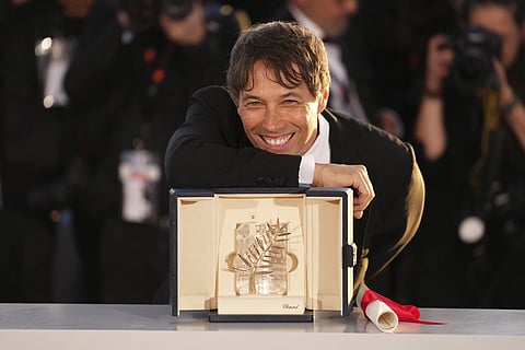 Sean Baker, winner of the Palme d’Or for the film 'Anora', poses for photographers during the photo call following the awards ceremony at the 77th international film festival, Cannes, southern France, Saturday, May 25, 2024.