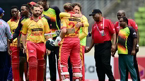 Zimbabwe’s players celebrate after winning the fifth Twenty20 international cricket match between Bangladesh and Zimbabwe at the Sher-E-Bangla National Cricket Stadium in Dhaka on May 12.