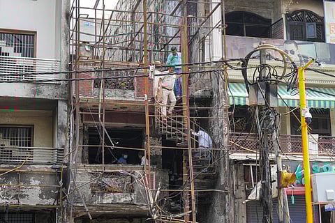 A Forensic Science Laboratory team investigates at the site of the fire at the Baby Care Hospital, at Vivek Vihar, in East Delhi on May 27, 2024.