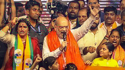 Union Home Minister Amit Shah with BJP candidate Madhavi Latha during a road show for Lok Sabha elections, in Hyderabad, Wednesday, May 1, 2024.