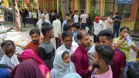 Family members cry at a mortuary where bodies of newborns, who died in a fire at children's hospital in east Delhi's Vivek Vihar, are kept, at GTB hospital in Delhi.