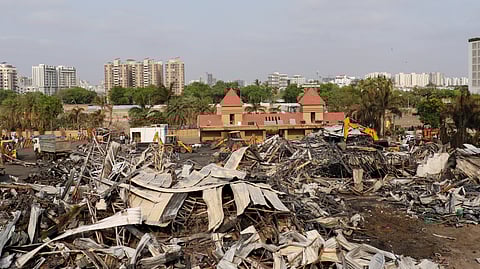 Debris being removed from the game zone site where a major fire on Saturday evening killed at least 28 people and injured three, in Rajkot, Sunday, May 26, 2024.