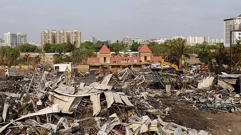 Debris being removed from the game zone site where a major fire on Saturday evening killed at least 28 people and injured three, in Rajkot, Sunday, May 26, 2024.