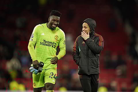 Manchester United goalkeeper Andre Onana smiles at the end of the English premier League soccer match between Manchester United and Sheffield at the Old Trafford Stadium in Manchester, England, Wednesday, April 24, 2024.