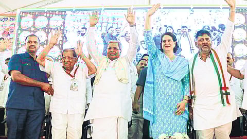 Congress leader Priyanka Gandhi Vadra along with Chief Minister Siddaramaiah, DCM DK Shivakumar and MLA Shamanuru Shivashankarappa at a public meeting in Davanagere on Saturday.