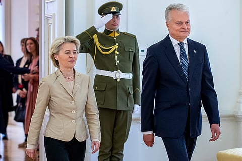 Lithuania's President Gitanas Nauseda, right, and European Commission President Ursula von der Leyen, left, arrive for their meeting at the Presidential palace in Vilnius, Lithuania, Thursday, May 9, 2024.