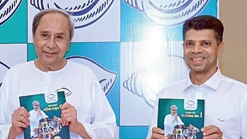CM Naveen Patnaik and BJD leader VK Pandian releasing the poll manifesto on Thursday