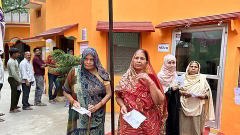 People seen waiting to cast their votes in Uttar Pradesh.