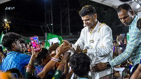 BJD's star campaigner and 5T Chairman VK Pandian greets people during a public meeting.