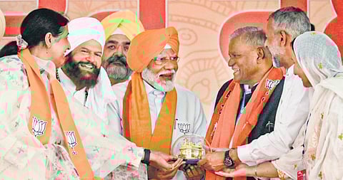 Prime Minister Narendra Modi being felicitated during a public meeting in support of BJP candidate Preneet Kaur for Lok Sabha elections in Patiala on Thursday.