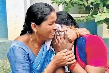 A parent of one of the rescued kids cries after the baby was handed over to CWC