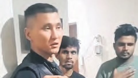 A Kyrgyzstan police officer explaining the safety precautions taken to Indian students