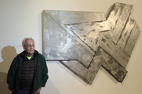 US artist Frank Stella stands in front of one of his works at an exhibition devoted to him in Warsaw, Poland, Feb 18, 2016.