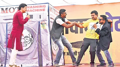 AAP’s Gopal Rai and Saurabh Bhardwaj participate in the launch of the ‘washing machine campaign’ at the party office in New Delhi on Tuesday.