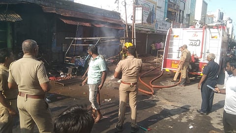 Fire services officials douse a fire caused by a gas cylinder explosion at an eatery in Tirunelveli on Thursday.