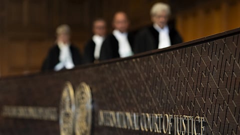 Judges enter the International Court of Justice, in The Hague, Netherlands, Thursday, May 16, 2024.