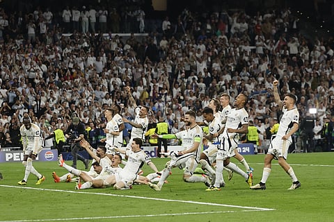 Real Madrid's players celebrate victory at the end of the UEFA Champions League semi final second leg football match between Real Madrid CF and FC Bayern Munich on May 8, 2024.