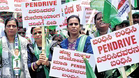 JDS women workers carry placards in a protest rally against Deputy Chief Minister DK Shivakumar at the DC’s office in Mysuru on Wednesday.