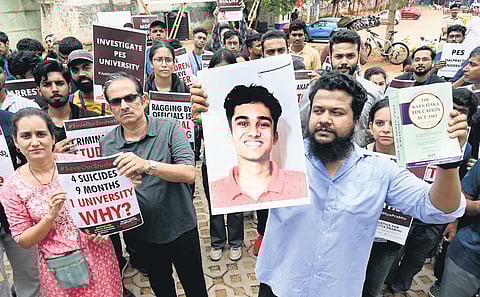 Parents of the deceased, volunteers and students protest against the university’s ‘harrassment’ of students, at Freedom Park on Saturday