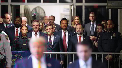 (From left) North Dakota Gov. Doug Burgum, U.S. Speaker of the House Mike Johnson and businessman Vivek Ramaswamy look on as former President Donald Trump talks to the media as he arrives at Manhattan criminal court in New York, on May 14, 2024.