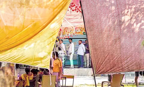 Tent installed at a polling booth of Jahangir Puri in north-west Delhi in view of rising temperature. Voters stood under its shade