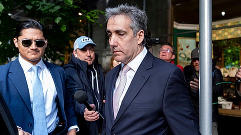 Michael Cohen leaves his apartment building on his way to Manhattan criminal court, Monday, May 13, 2024, in New York.