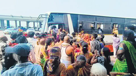 Devotees scramble to board a minibus arranged by the TSRTC and temple authorities to reach the Sri Lakshmi Narasimha Swamy Devasthanam for darshan