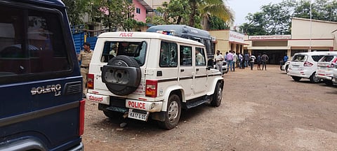 Damaged police vehicles standing in front of the Channagiri police station on Saturday.