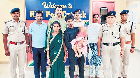 Pradeep Lohra and his wife with their baby boy in front of RPF police station in Cuttack.
