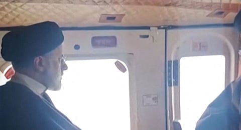 This grab taken from handout video footage released by the IRINN Iranian state television network on May 19, 2024 shows Iran's President Ebrahim Raisi on board a helicopter in the Jolfa region of the western province of East Azerbaijan.